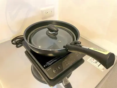 a pot sitting on top of a stove at Shibamata house self check in in Tokyo