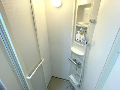 a small bathroom with a toilet and a sink at Shibamata house self check in in Tokyo