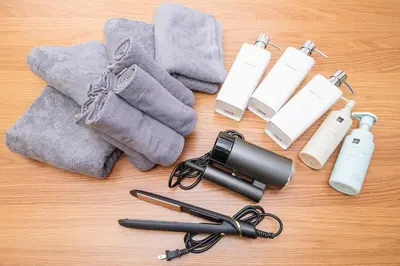 a table with a camera a pen and some towels at Japan Tokyo Ueno Ikebukuro private house 5Ppl 3Bed 37m2 for Family in Tokyo