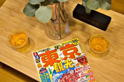 a table with a book and two glasses and a vase at \u897f\u65b0\u5c0f\u5ca94\u4e01\u76ee in Tokyo