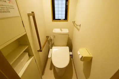 a small bathroom with a toilet in a stall at \u897f\u65b0\u5c0f\u5ca94\u4e01\u76ee in Tokyo