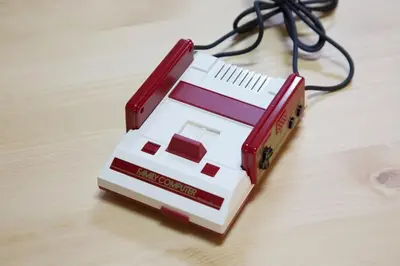 a red and white appliance sitting on top of a table at \u897f\u65b0\u5c0f\u5ca94\u4e01\u76ee in Tokyo