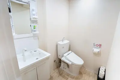 a white bathroom with a sink and a toilet at Free parking Shiinamachi Station 10 min walk Convenient transportation One stop direct to Ikebukuro in Tokyo