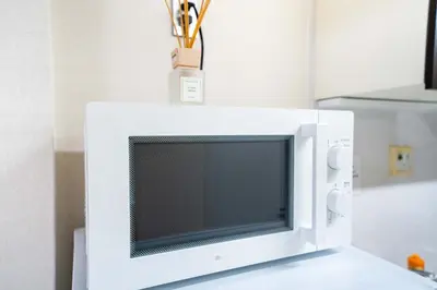 a white microwave oven sitting on top of a counter at Free parking Shiinamachi Station 10 min walk Convenient transportation One stop direct to Ikebukuro in Tokyo