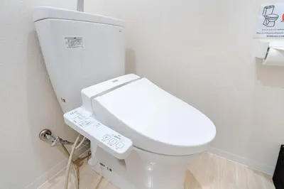 a bathroom with a white toilet with a remote control at Free parking Shiinamachi Station 10 min walk Convenient transportation One stop direct to Ikebukuro in Tokyo