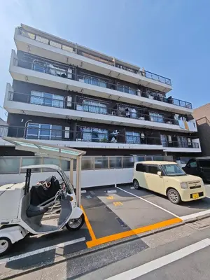a car parked in a parking lot next to a building at Free parking Shiinamachi Station 10 min walk Convenient transportation One stop direct to Ikebukuro in Tokyo