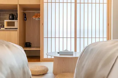 a living room with a table and two chairs at Racto Hotel Ikebukuro \u697d\u9014\u30db\u30c6\u30eb \u6c60\u888b in Tokyo