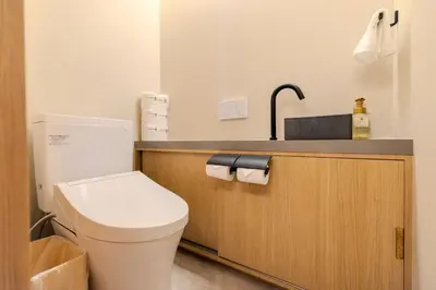 a bathroom with a white toilet and a sink at Racto Hotel Ikebukuro \u697d\u9014\u30db\u30c6\u30eb \u6c60\u888b in Tokyo