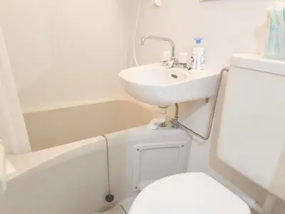 a bathroom with a sink and a toilet and a tub at Shinjuku Tokyo \u6771\u4eac\u65b0\u5bbf SS in Wada