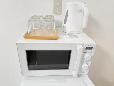 a white microwave with a blender on top of it at Shinjuku Tokyo \u6771\u4eac\u65b0\u5bbf SS in Wada