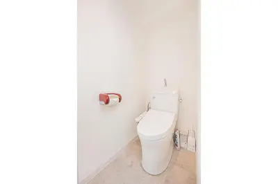 a bathroom with a toilet and a roll of toilet paper at Tawaramachi Stay 2 minutes' walk from Tawaramachi Station and 10 minutes' walk from Asakusa Station in Tokyo