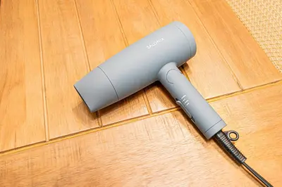 a wii remote sitting on top of a wooden floor at Tawaramachi Stay 2 minutes' walk from Tawaramachi Station and 10 minutes' walk from Asakusa Station in Tokyo