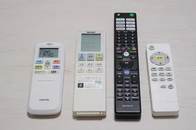 a group of remote controls sitting next to each other at 15minutes walk from Skytree -Mukojima House- in Tokyo