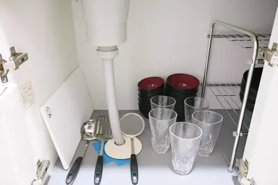 a group of glasses and a lamp on a counter at 15minutes walk from Skytree -Mukojima House- in Tokyo