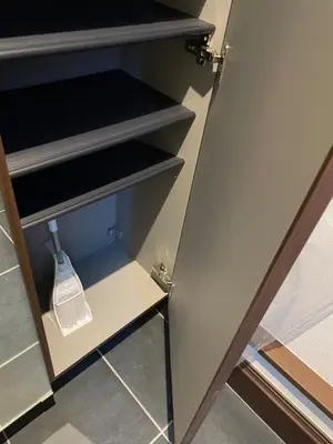 a cupboard with a door open with a whisk in it at Met\u539f\u753a1\u4e01\u76ee in Tokyo