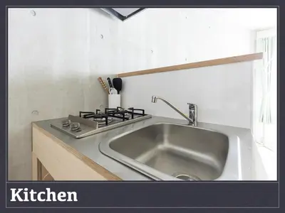 a kitchen with a sink and a stove at Tokyo Oji Apartment 3A in Tokyo