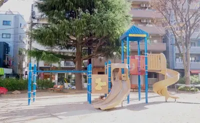 a playground with a slide in a park at Tokyo Oji Apartment 3A in Tokyo