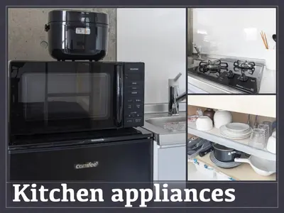 a picture of a kitchen with a coffee maker on top of a microwave at Tokyo Oji Apartment 3B in Tokyo