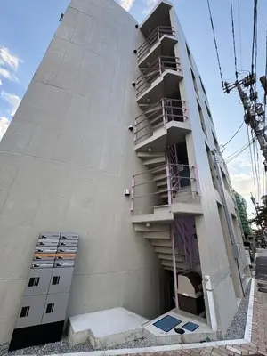 a building with stairs on the side of it at Tokyo Oji Apartment 3B in Tokyo