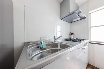 a kitchen with a sink and a stove at 12min walk from Ikebukuro Station Max 15 people in Tokyo