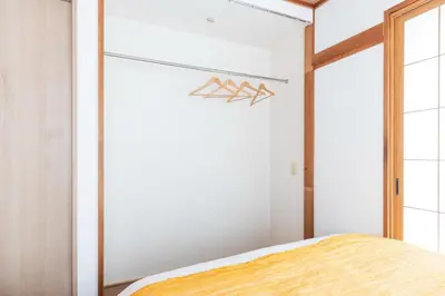 a bedroom with white walls and a large window at 12min walk from Ikebukuro Station Max 15 people in Tokyo