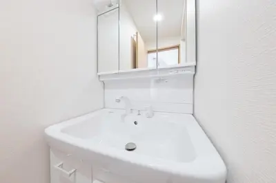 a white bathroom with a sink and a mirror at 12min walk from Ikebukuro Station Max 15 people in Tokyo