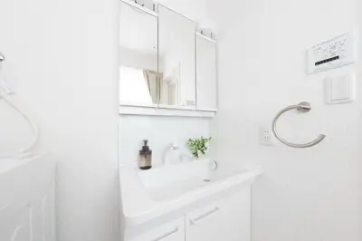 a white bathroom with a sink and a mirror at Direct to Asakusa Ginza & NRT HND 2025 New House in Tokyo