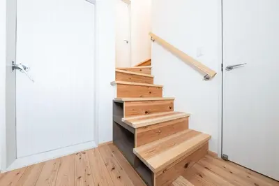 a staircase in a house with wooden floors and a door at Direct to Asakusa Ginza & NRT HND 2025 New House in Tokyo