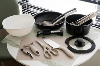 a table with bowls and utensils on it at THE CAMINO Nakano 302 in Tokyo