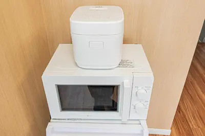 a coffeemaker sitting on top of a microwave at Komorebi Asakusa Cozy 4P Stay The 77 House Tokyo in Tokyo