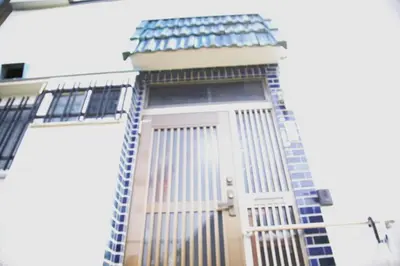 a building with an american flag on it at Sweet House\u6771\u6c60\u888b in Tokyo
