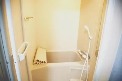 a small bathroom with a tub and a sink at Sweet House\u6771\u6c60\u888b in Tokyo