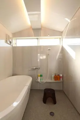 a bathroom with a tub and a shower and a sink at Shinjuku Gyoen house 2LDK in Tokyo