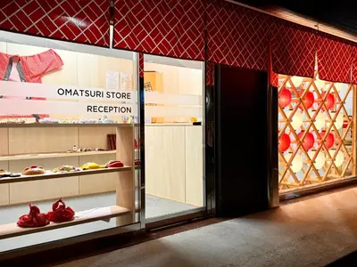 a display case in a store with some food at OMATSURI BASE Nakanoshimbashi in Tokyo