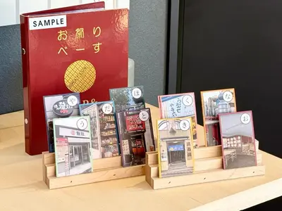 a group of books on display on a table at OMATSURI BASE Nakanoshimbashi in Tokyo