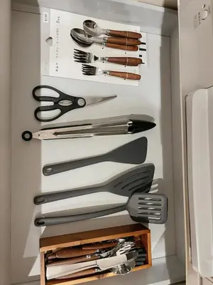 a drawer full of knives and utensils in a refrigerator at \u65b0\u5bbf\u5fa1\u82d1 \u5f92\u6b698\u5206 \u65b0\u5bbf\u4e09\u4e01\u76ee\u99c5\u5f92\u6b698\u5206 WiFi\u7121\u6599 in Tokyo