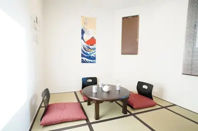 a dining room with a table and two chairs at Chihaya house \u5343\u65e9\u30cf\u30a6\u30b9 in Tokyo