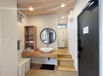 a bathroom with a sink and a mirror at \u677e\u5c4b\u30db\u30c6\u30eb4\u968e in Tokyo