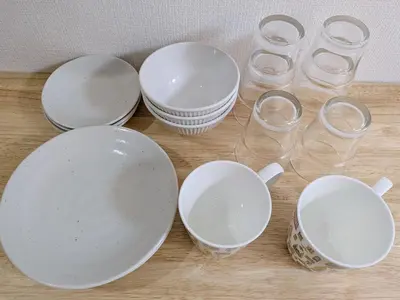 a group of empty bowls and glasses on a table at Laze Nakano 2bed Travel Work Broadway in Tokyo