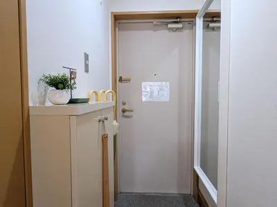 a hallway with a door leading into a room at Laze Nakano 2bed Travel Work Broadway in Tokyo