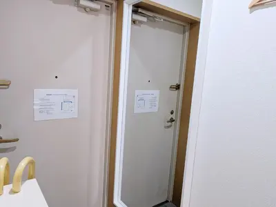 a bathroom with a shower and a door at Laze Nakano 2bed Travel Work Broadway in Tokyo