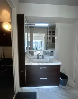 a bathroom with a sink and a large mirror at Miyazaki in Tokyo