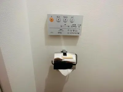 a toilet paper dispenser with a roll of toilet paper at Miyazaki in Tokyo