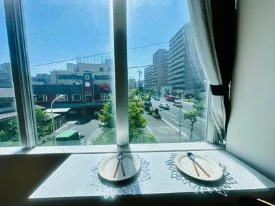 two surfboards sitting on a window sill at Miyazaki in Tokyo