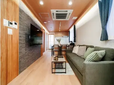 a living room with a couch and a table at Alice \u6c60\u888b\u76ee\u767d\u96c5\u5bbf in Tokyo