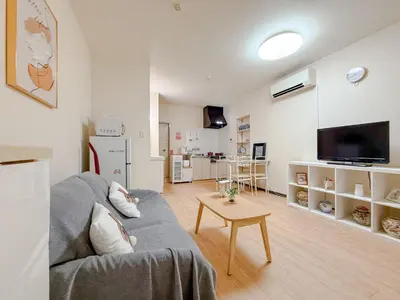 a living room with a couch and a table at Itabashi City, Nakadai 2LDK-IT0395 in Tokyo