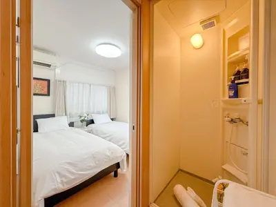 a small room with two beds and a closet at Itabashi City, Nakadai 2LDK-IT0395 in Tokyo
