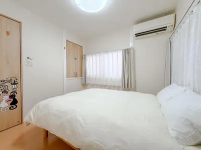 a bedroom with a white bed and a window at Itabashi City, Nakadai 2LDK-IT0395 in Tokyo