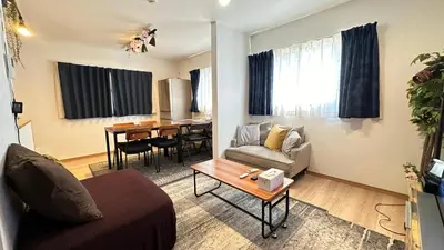 a living room with a couch and a table at RelaxKoenjiHouse! 3LDK 4minSta Shinjuku7min Bright,Fun,Cozy! KidsFree Under6yrs in Tokyo