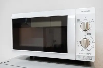 a white microwave oven sitting on top of a counter at Ohanachaya station 5-minute walk 4ldk house maxi 9people family friendly in Tokyo